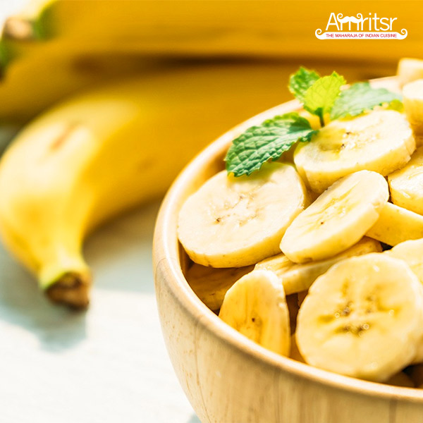 Banana slices in a wood bowl