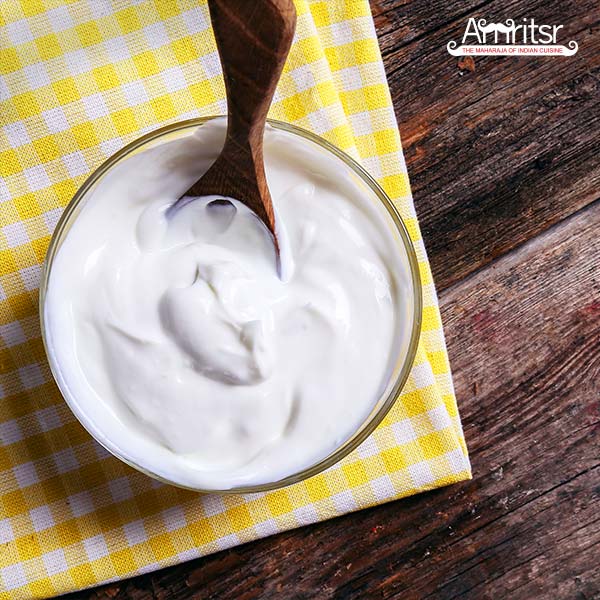 Tasty yogurt present in a glass bowl